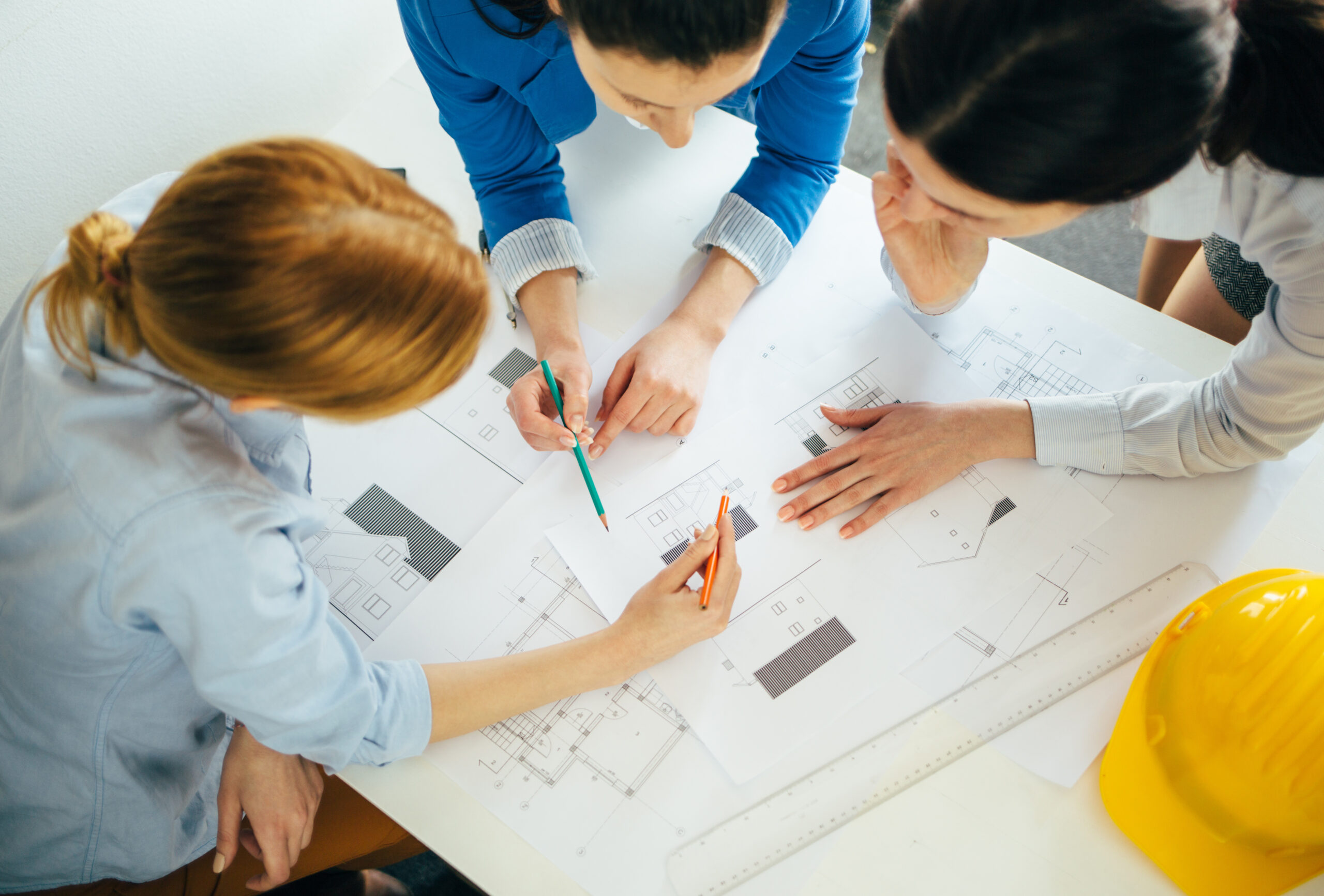 HighAngleViewOfTeamOfArchitectsWorkingOnConstruction – Division 9 Commercial Inc